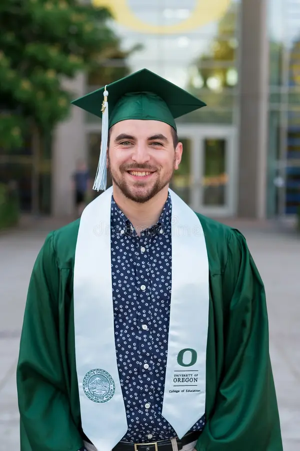 graduate smiling happily
